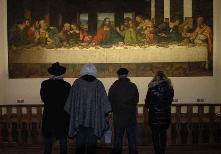 Storaro, Acosta, Ferretti and Lo Schiavo study a beautiful and faithful replica of <em>The Last Supper</em>; a canvas thought to be executed by Leonardo’s studio with the same cartoons used to paint the original and a piece that has been well preserved. Tongerlo Abbey, home to the mural since 1545, is located near Antwerp, in Westerlo Belgium. <span style=""font-size: 9px;"">© AFA vzw</span>